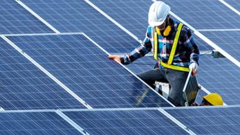 Workman on solar panels