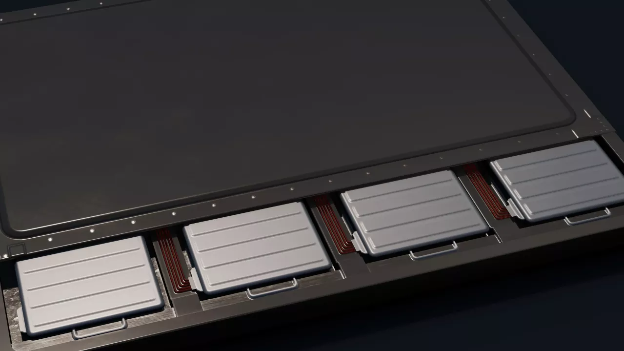 An image showing a close-up of a row of gray electric vehicle battery modules inserted in slots with visible connection cables. The view is semi-open from the hinge side of the laptop.