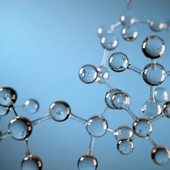 3D illustration of a molecular structure with transparent spherical elements connected by sticks, set against a gradient blue background.