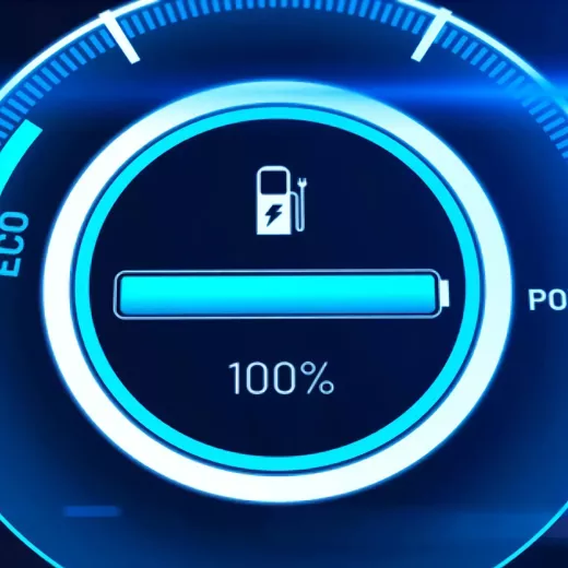 A digital display of a vehicle’s battery level showing a full charge at 100%, with an icon of a fuel pump and a plug, framed by an eco and power gauge.